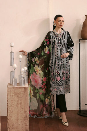 Woman wearing a floral and patterned outfit in a decorated room.