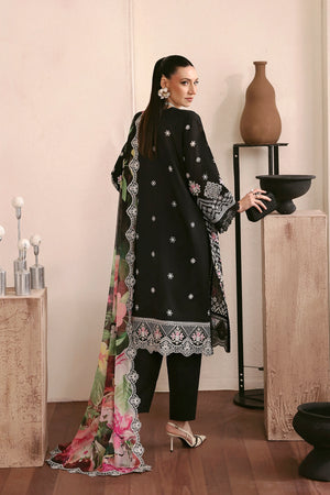Woman in a black embroidered outfit with a floral scarf in a minimalistic setting